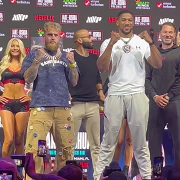 Anthony Joshua grabs Jake Paul in the face off!!