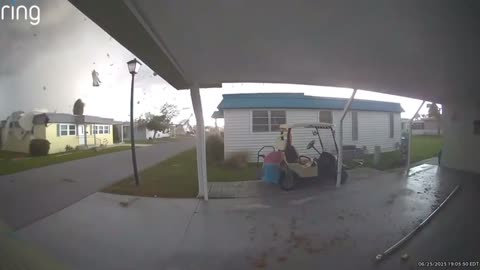 A house is ripped off the ground after a tornado touched down in Largo, Florida on Wednesday.