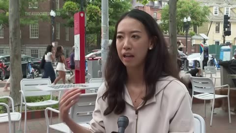 Fight breaks out behind Harvard graduate as she reflects on recent division