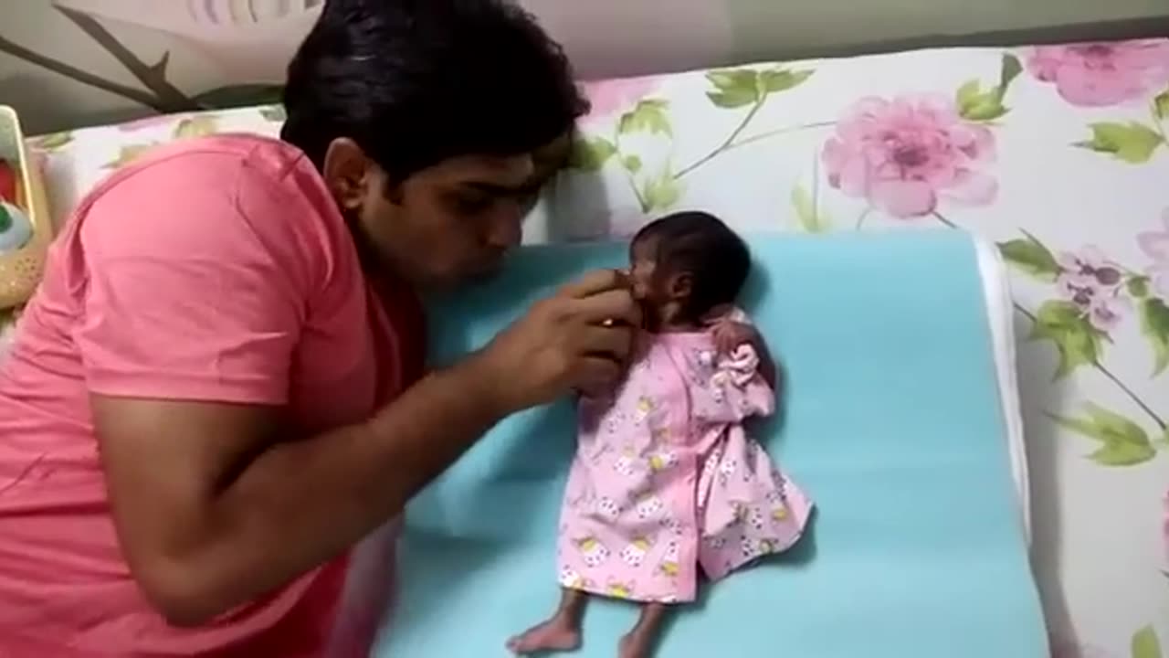 Baby Playing With Dad