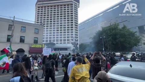 So 2025. LA protest 6/9/25. Fireworks being thrown at cops. Cops return fire to rooftop assaulter