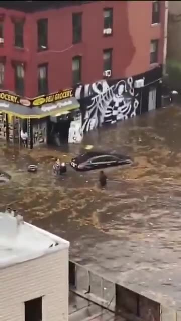 Two people died when heavy rainfall led to flash flooding, inundating streets and