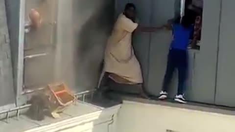 Heart-stopping moment hero rescues babies from burning apartment