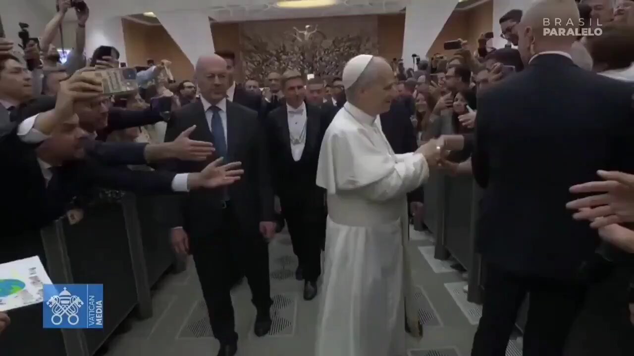 Pope Leo XIV turns his back and refuses to acknowledge an LGBT flag.