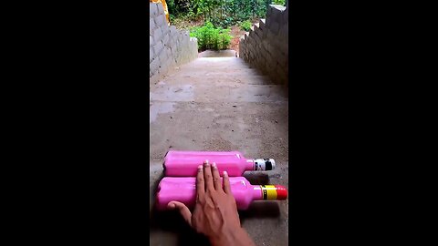 Incredible different colours of bottles falling from stairs to check hardness