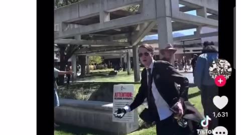 American has been going through the Charlie Kirk videos and saw a man with a AR 15 strap