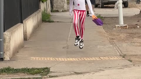Small Creepy Clown Skips Down Street
