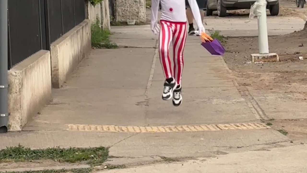 Small Creepy Clown Skips Down Street