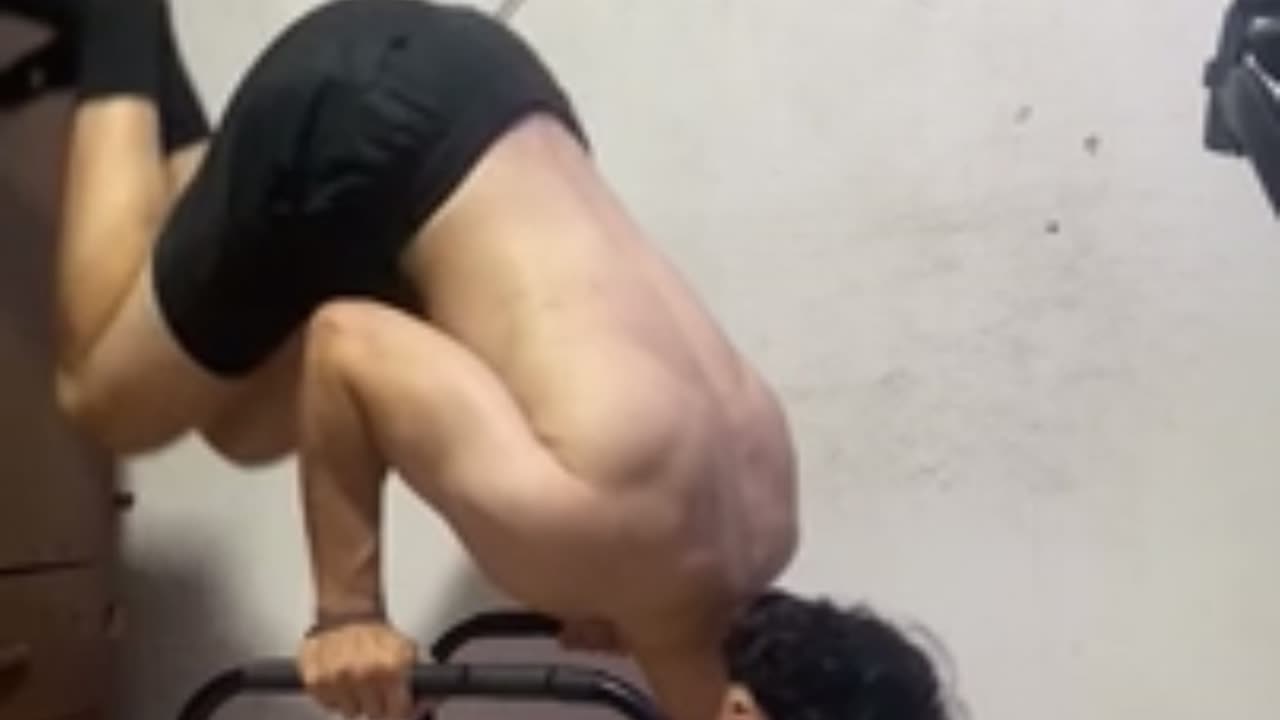 Man Falls With Thud While Doing Handstand on Table