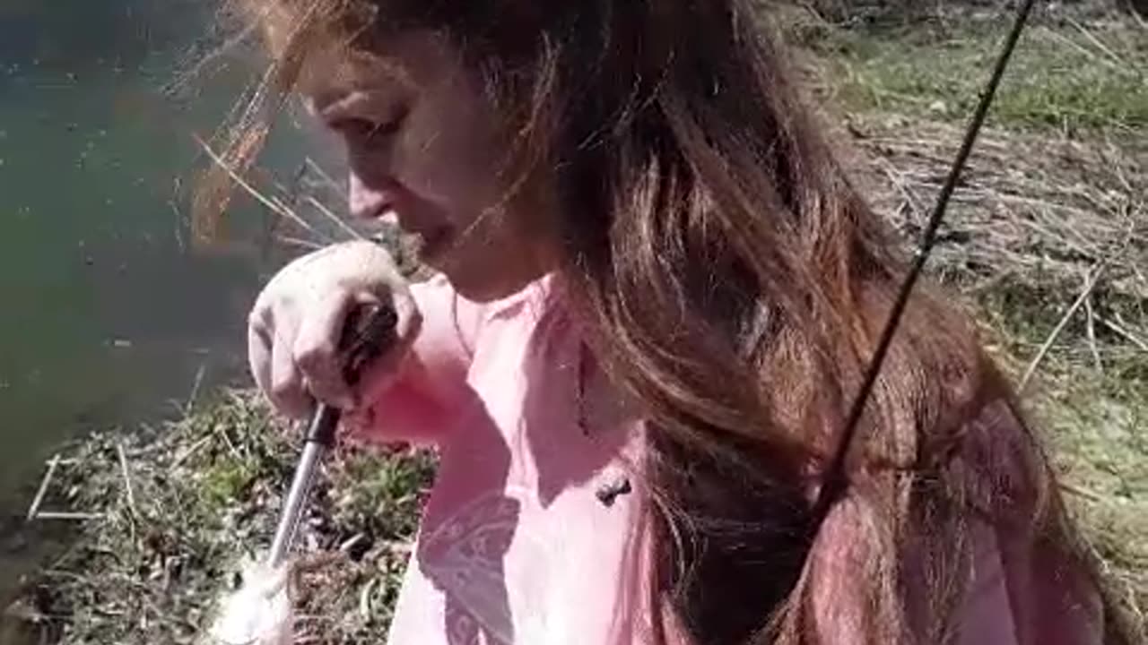 Redhead trying to save a Rainbow Trout