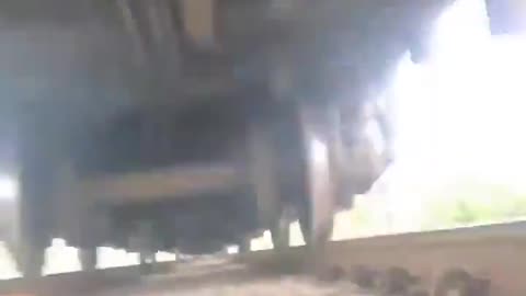 Guy lays down on train tracks