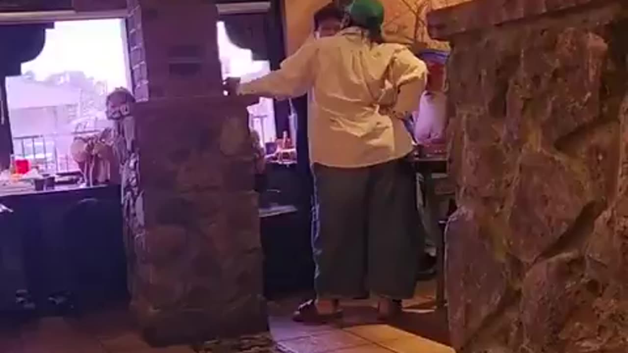 Unhinged tolerant leftist goes berserk on man eating in a restaurant with a