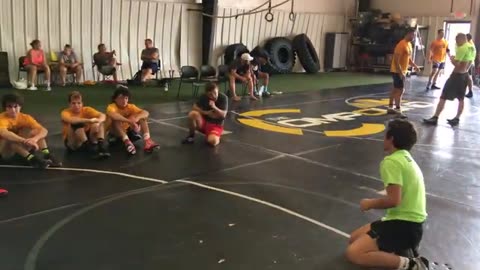 Dance Coaching Campers Through Head Pinch
