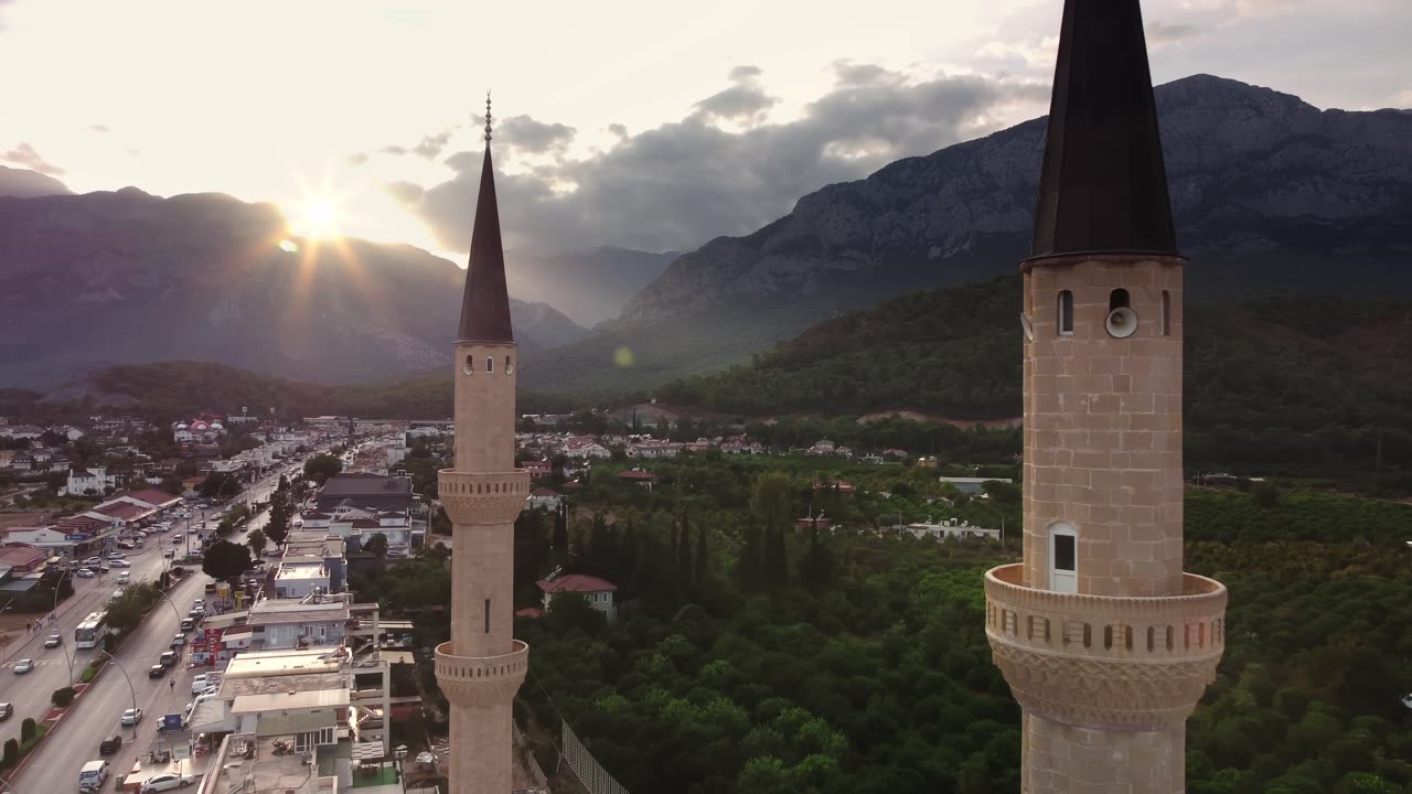 Scenic View of Kemer City and Mosque with Majestic Mountain Backdrop