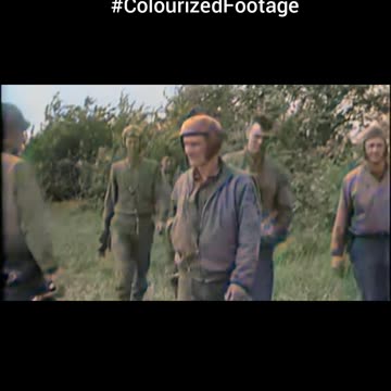 1944 Sherman crew returns on foot 🚶‍♂️ Tank burns in distance behind 🔥 #Colourized