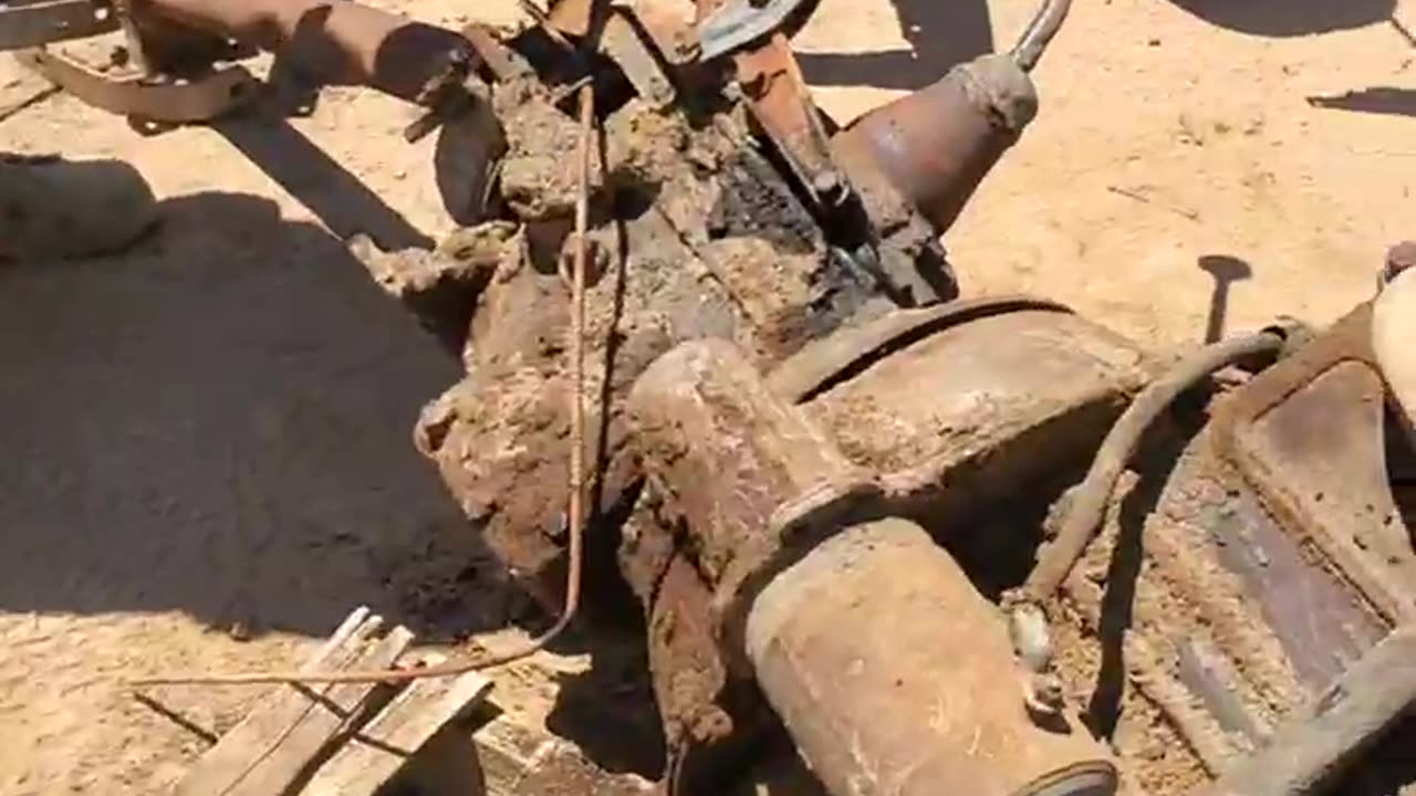 060825 49 Flathead Ford J.O., Karson and I try to get the trans off