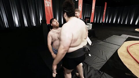 A competition between two men to throw each other out of the circle.