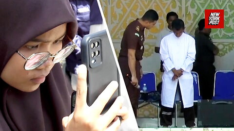 Indonesian court publicly cane men for hugging and kissing