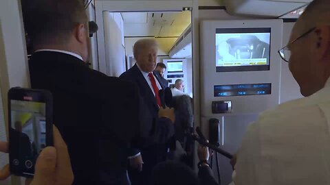 President Donald J. Trump speaks to reporters on Air Force One en route to Alaska