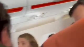 A man aboard an easyJet flight to Scotland was subdued by a fellow passenger