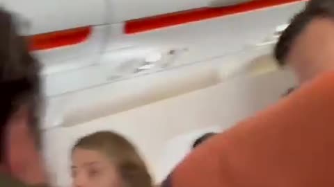 A man aboard an easyJet flight to Scotland was subdued by a fellow passenger