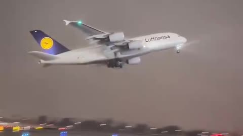 Airbus A380 of Lufthansa dissolves into the clouds during takeoff at Los Angeles airport, USA