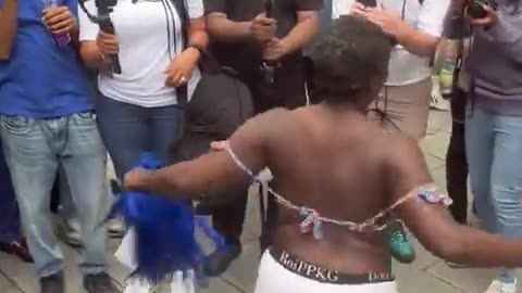 Diddy fans celebrate his verdict outside the courthouse by pouring baby oil on each other