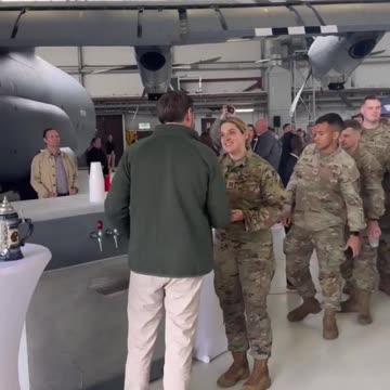 Vice President Vance at Ramstein Air Base serving beers to troops during a refueling stop.