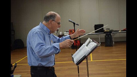 Allan Myerson conducts an early morning orchestra.