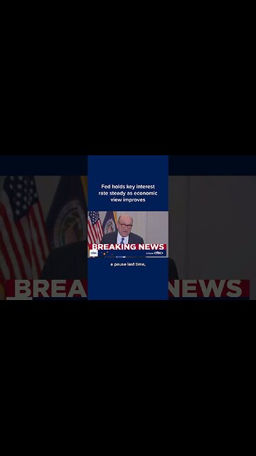 Fed holds key interest rate steady as economic view improves