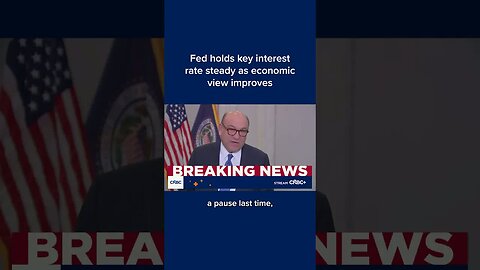 Fed holds key interest rate steady as economic view improves