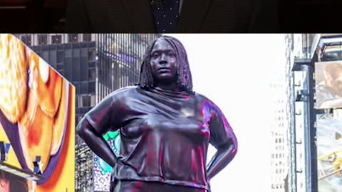 12-foot Tall Statue Erected in Times Square “confronts preconceived notions of identity”
