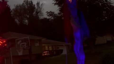Giant Animatronic Scarecrow at Night