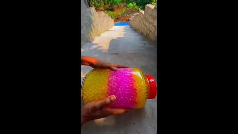 Incredible different colours of bottles falling from stairs to check hardness