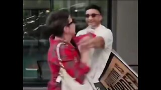 Woman attacks a protester in front of her daughter, causing her to cry in distress