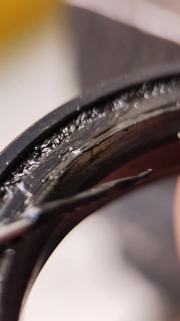 How to easily open the dust seal of a sealed bicycle bearing.
