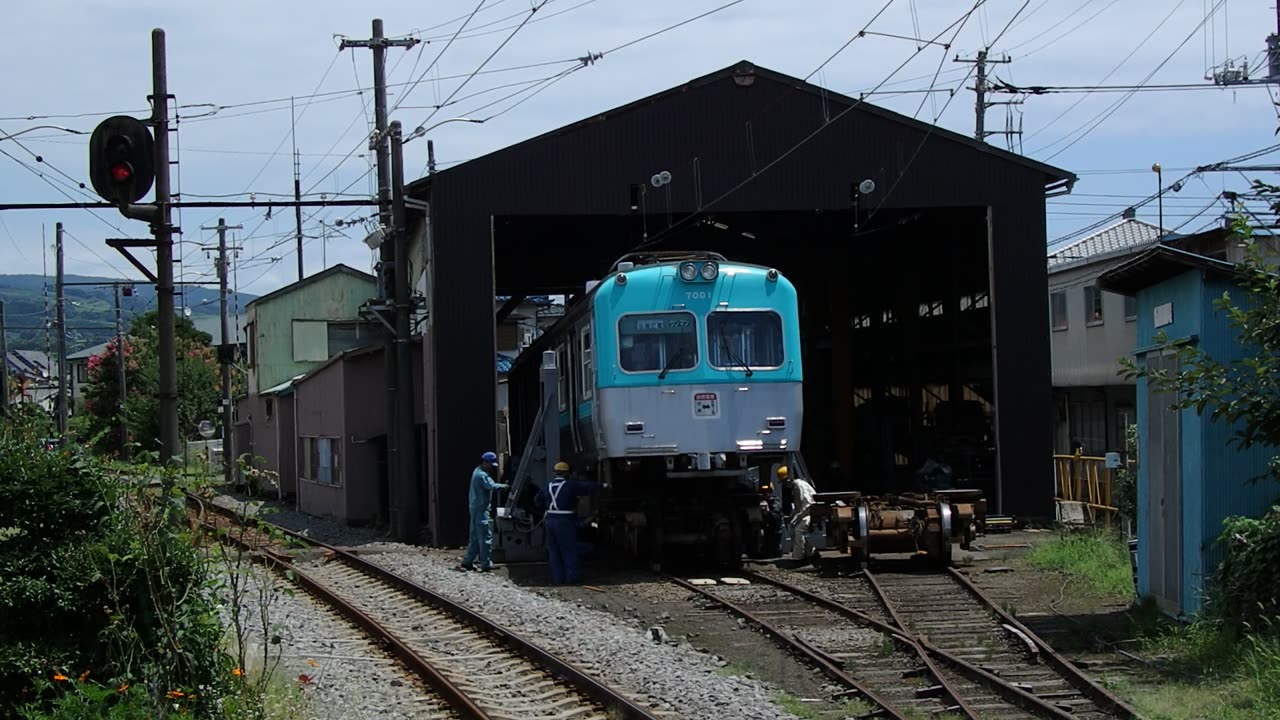 Workers pushing the Truck assembly