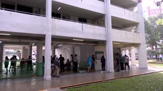 Singapore's prime minister casts his vote in first electoral test