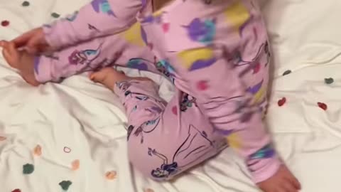 Girl Covers Cat In Hair Bows