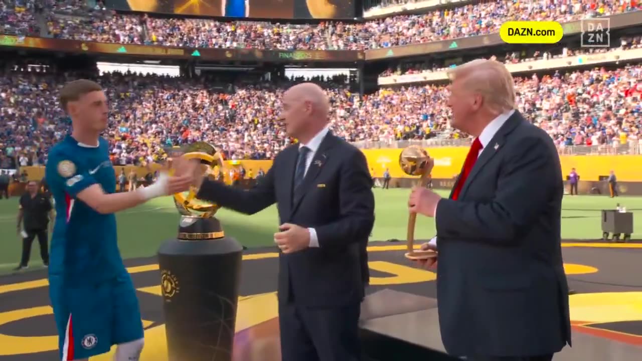 Donald Trump presenting the Player of the The Golden Ball to Cole Palmer