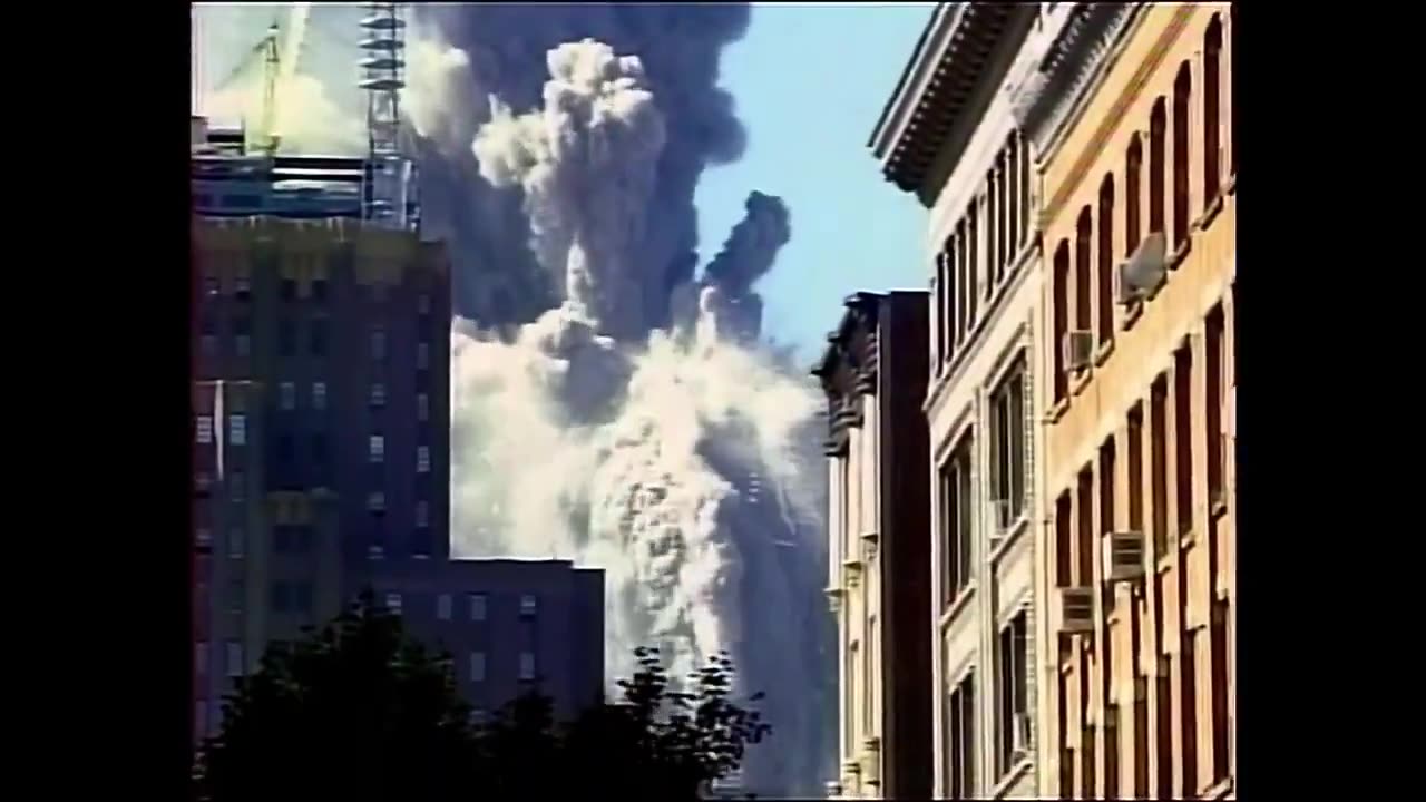 North Tower "spire" turning into dust... Controlled Demolition Expert