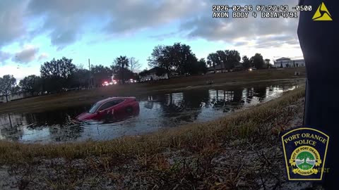 Officers rescue man from partially submerged car in pond after he fell asleep at the wheel