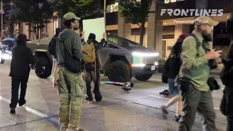🚨 Antifa just tried to surround a Tesla Cybertruck but realized it has multiple