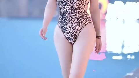 Swimsuit beauty shows off her charming figure