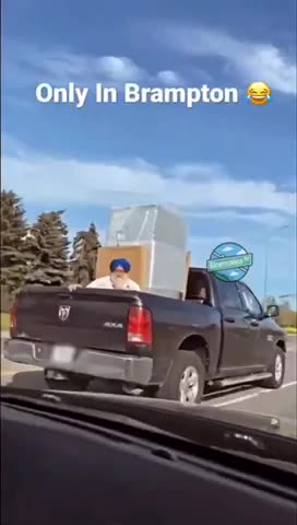 Only in Brampton: old man in turbine rides with appliances in back of truck