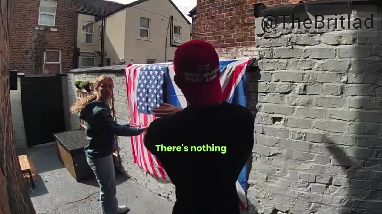 Young woman who lives at the back of this patriots house confronts him