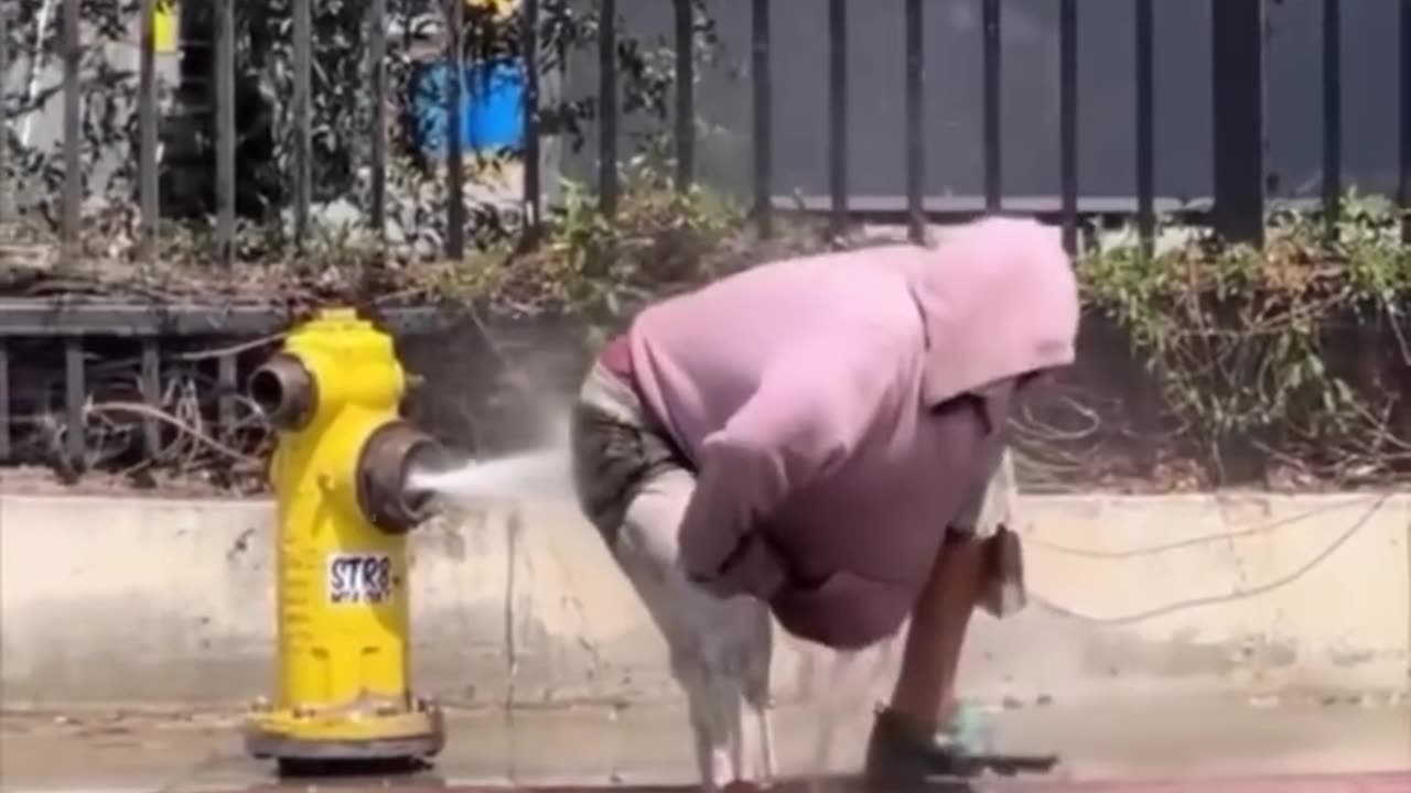 Nigger taking a bath in public