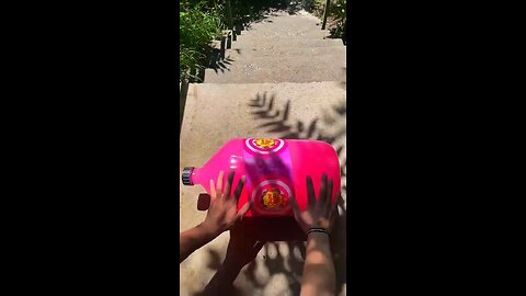 Incredible different colours of bottles falling from stairs to check hardness