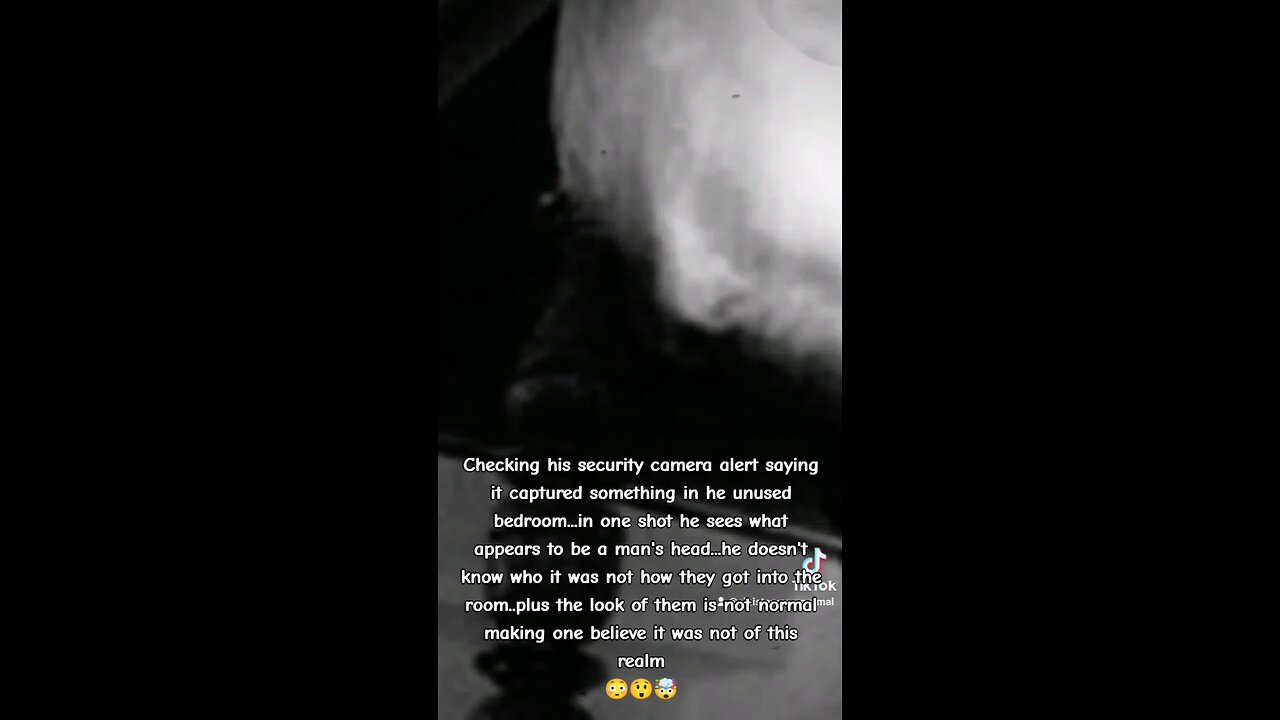 Ghost face captured in locked bedroom by security camera