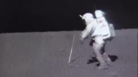 IMAGINE.. being filmed on the moon using a hammer to install a small flag pole